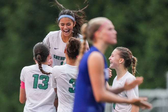 Cathedral Fighting Irish players celebrate a goal Wednesday, Sept. 27, 2023, during the IHSAA Soccer City Championship at Bishop Chatard High School in Indianapolis. Cathedral Fighting Irish defeated the Bishop Chatard Trojans, 3-0.