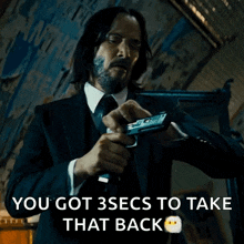 cocking-pistol-john-wick.gif