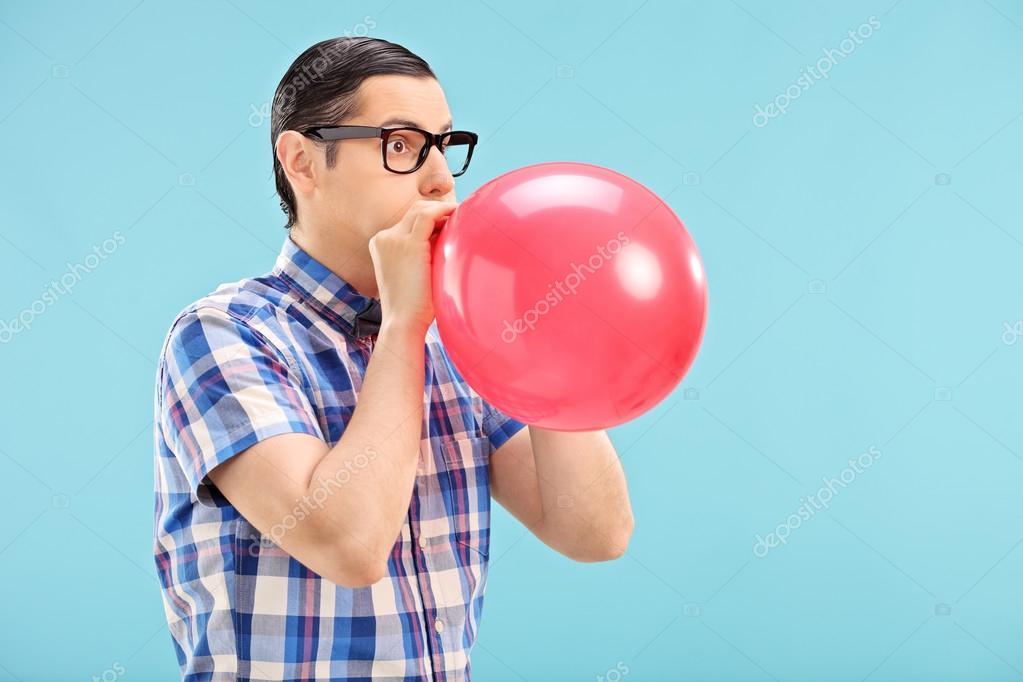 depositphotos_48315683-stock-photo-man-blowing-up-balloon.jpg