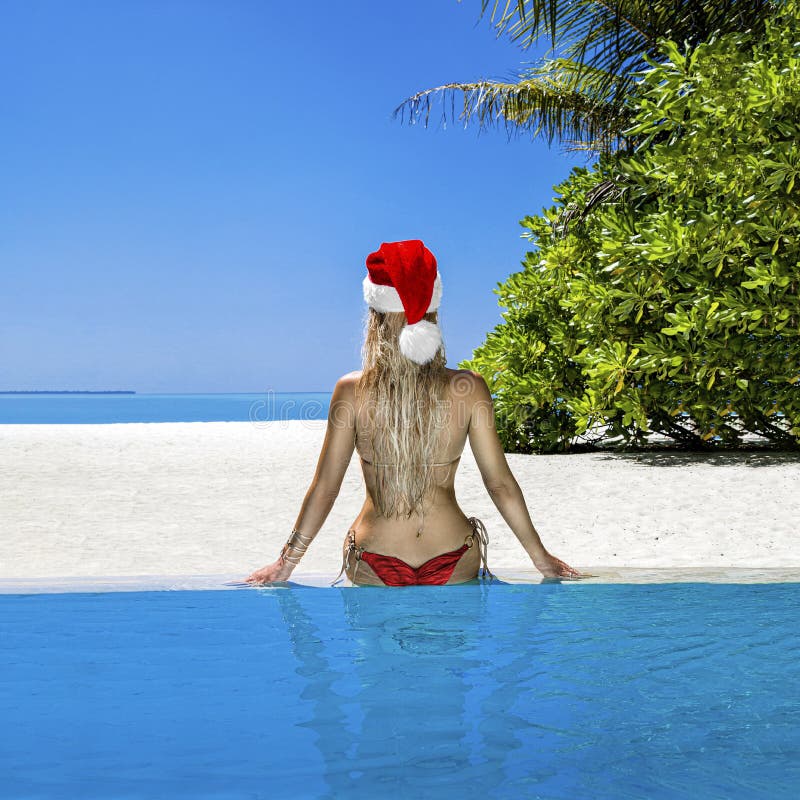 christmas-travel-beach-holidays-maldives-christmas-maldives-beach-santa-claus-woman-bikini-girl-wearing-santa-hat-relaxing-165733783.jpg