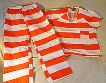 220px-Contemporary_orange-white_striped_prison_uniform.JPG